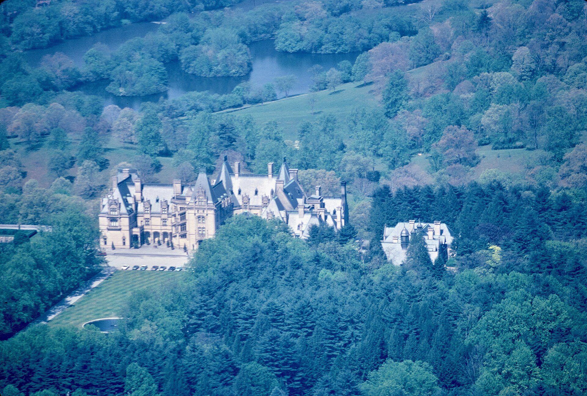 Aerial view of the Vanderbilt family's Biltmore House surrounded by woodland in Asheville, North Carolina, photographed in May 1964
