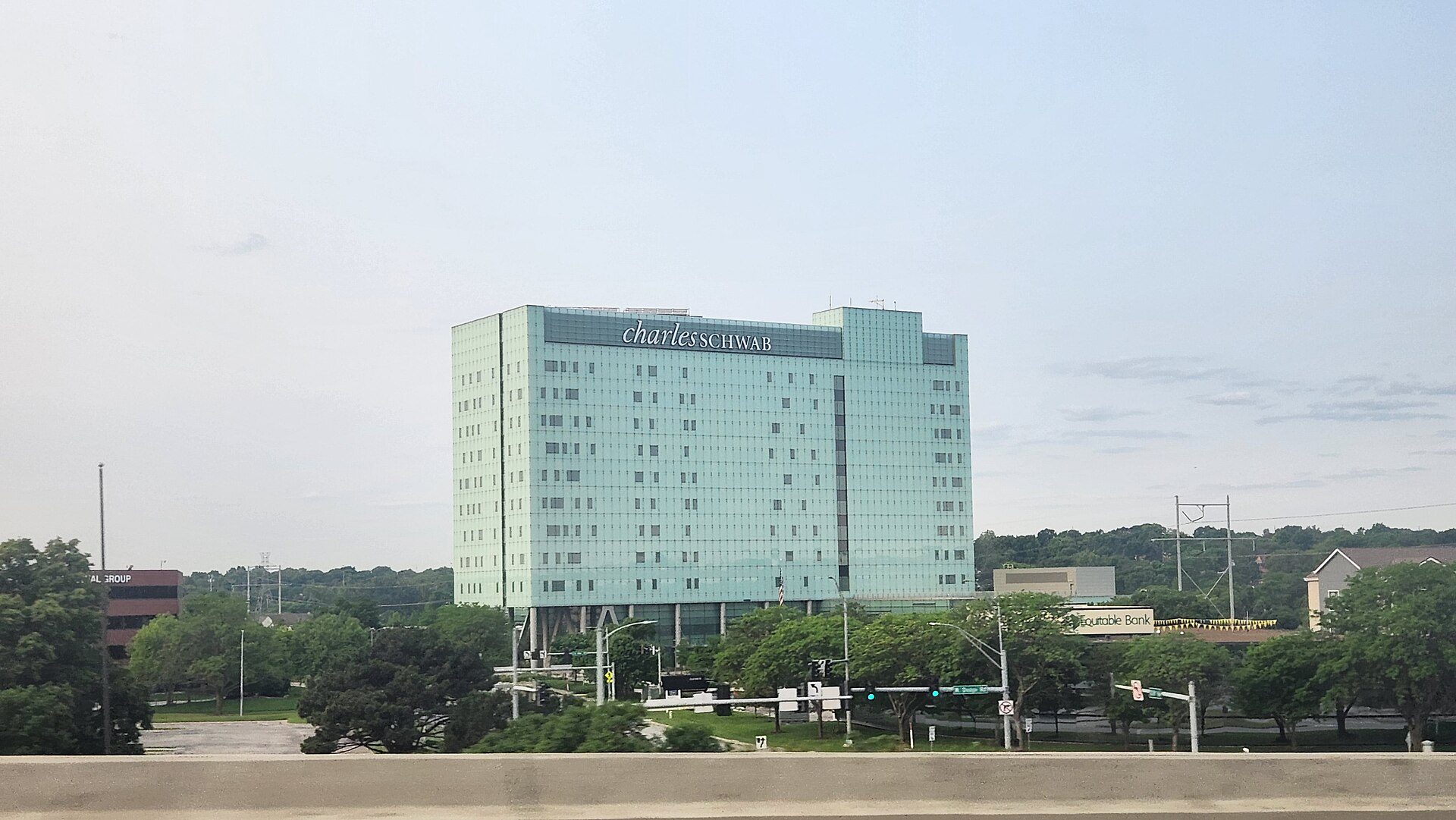 Charles Schwab office building in Omaha, Nebraska, with the company's name at the top