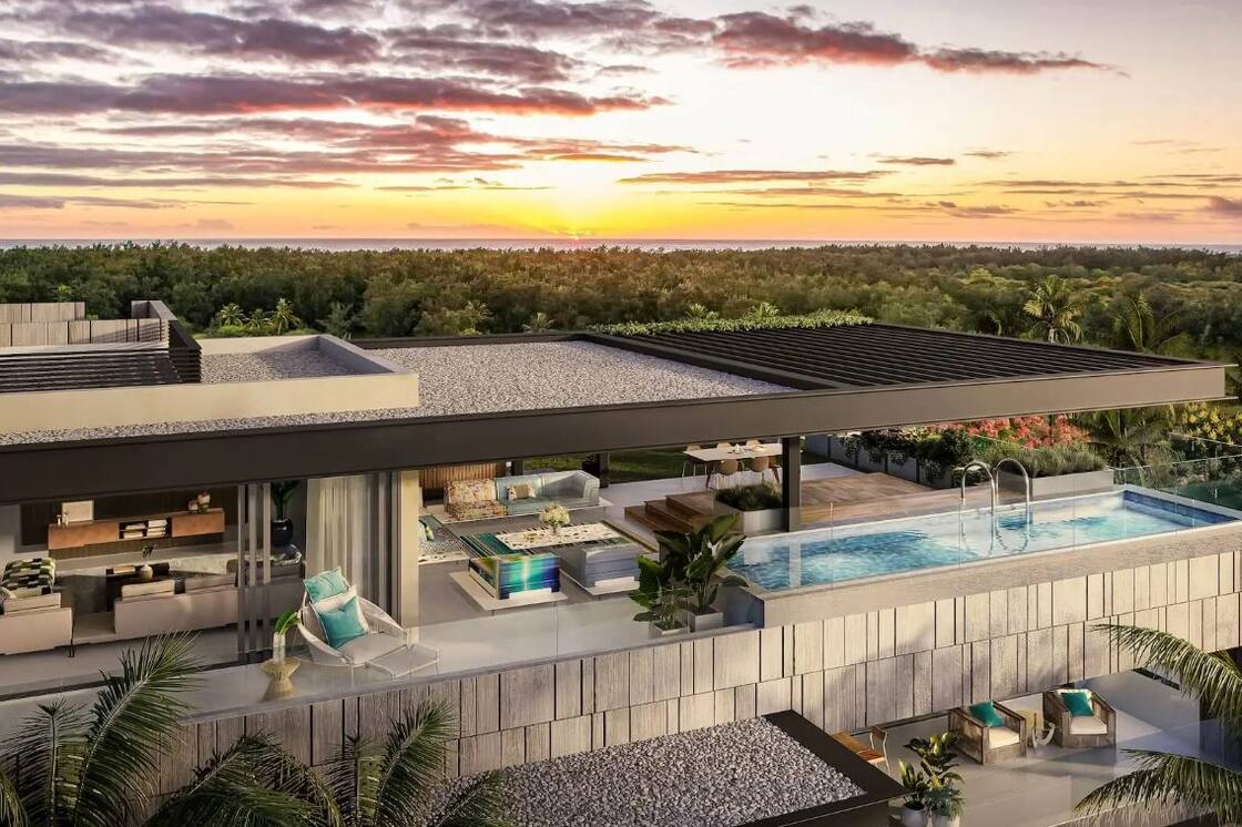 Visualisation of a residence at Mont Choisy, Mauritius, with a rooftop terrace and pool overlooking palm trees and the sea at sunset.