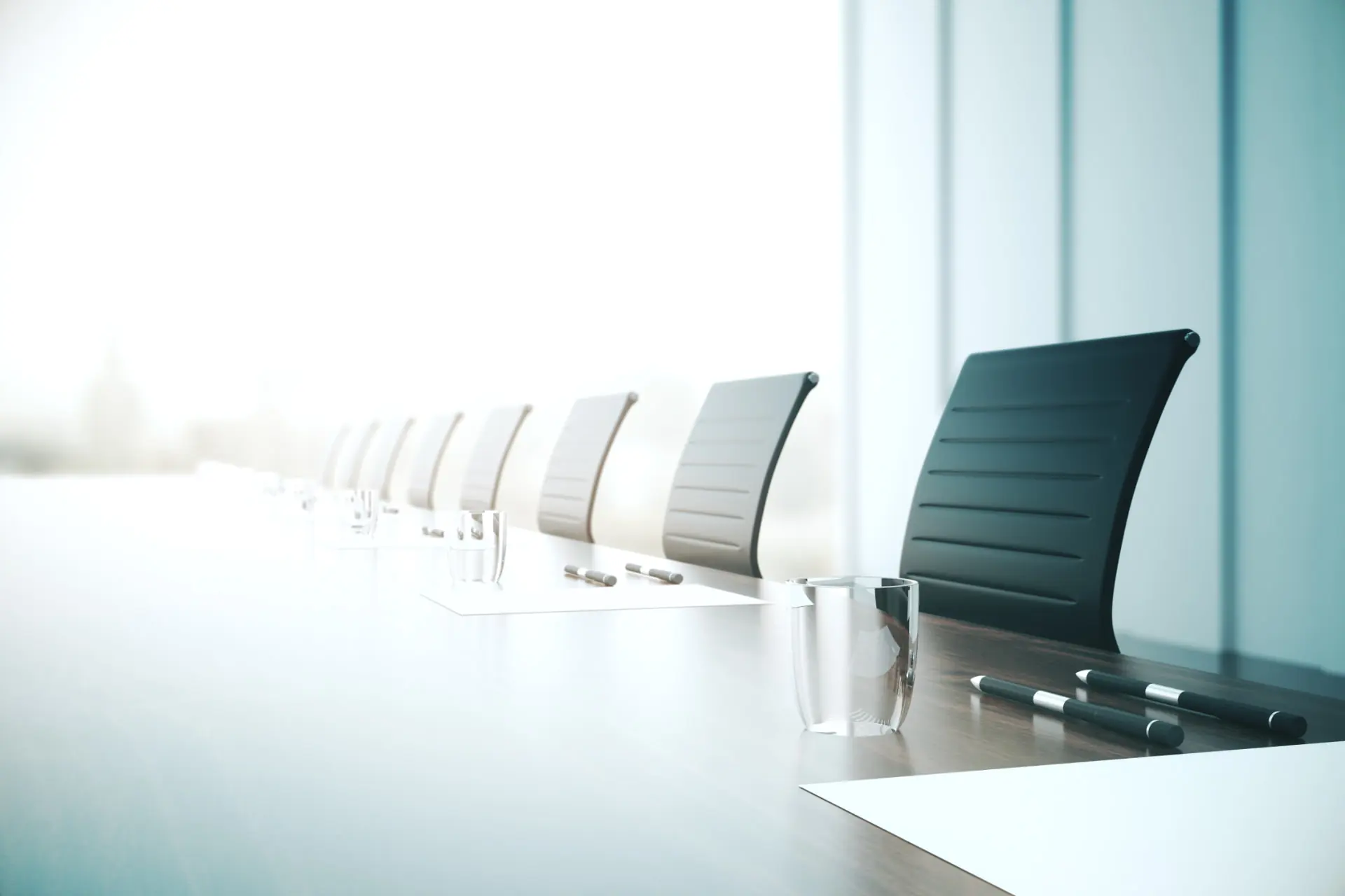 Executive boardroom with a long table and city view — UK Private Wealth Magazine