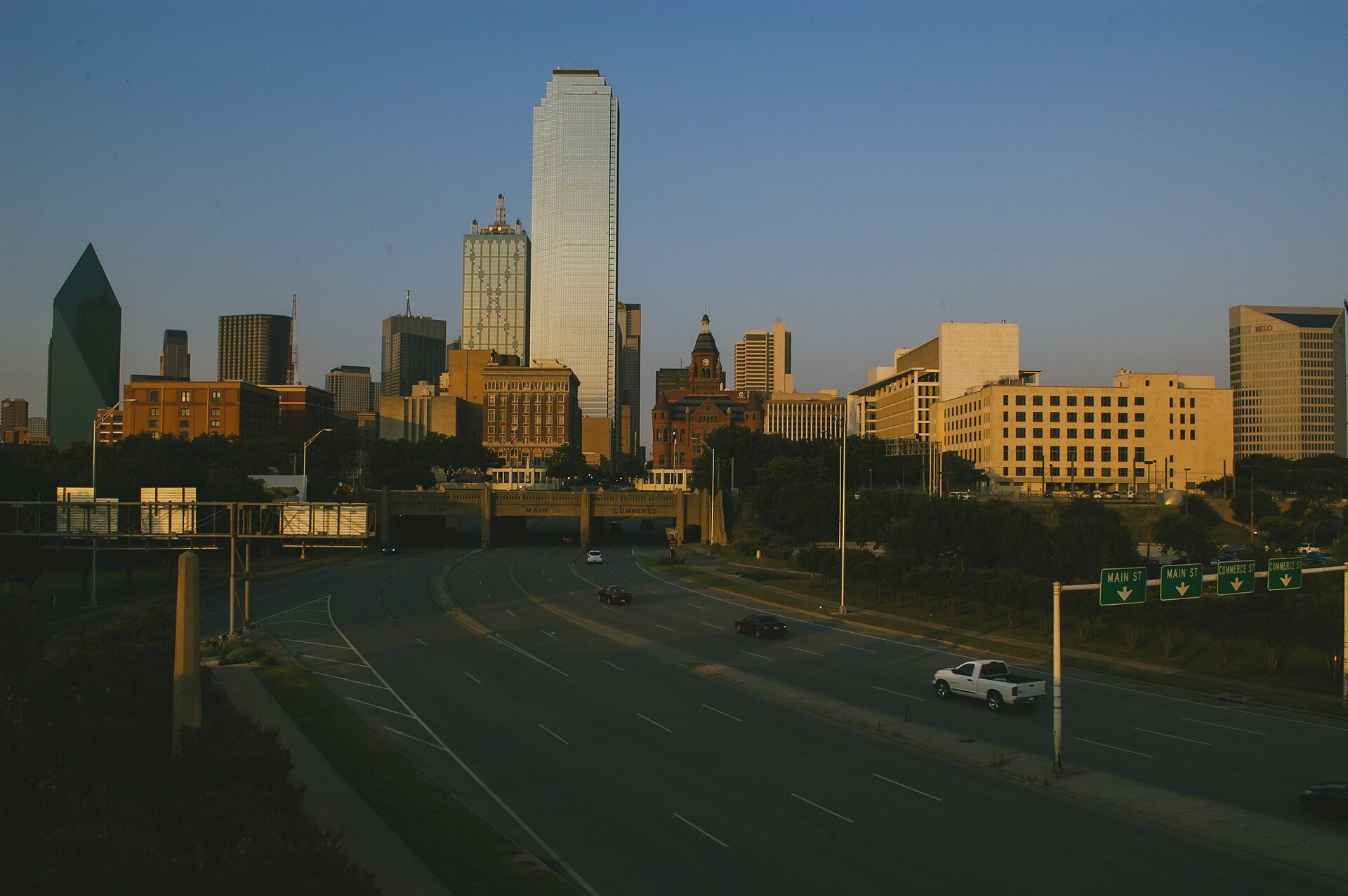 Downtown Dallas skyline in the evening seen from a highway approach
