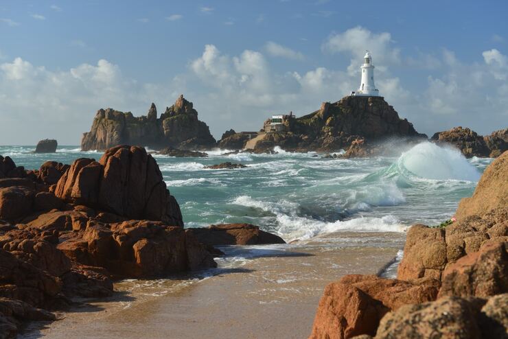 Lighthouse on a rocky coastline in Jersey