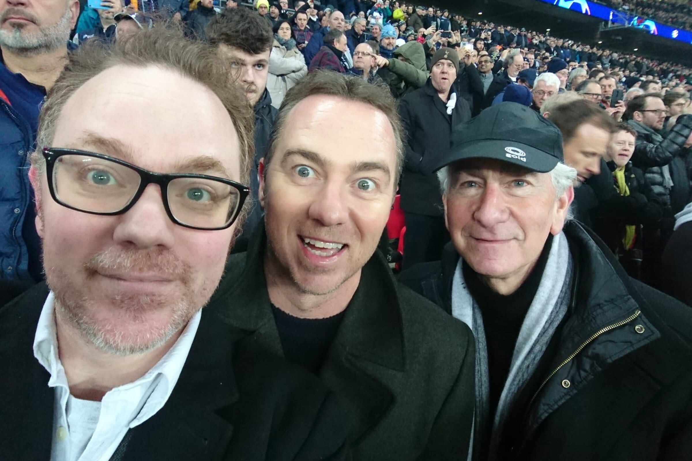 Ian Morley at a football match with companions.