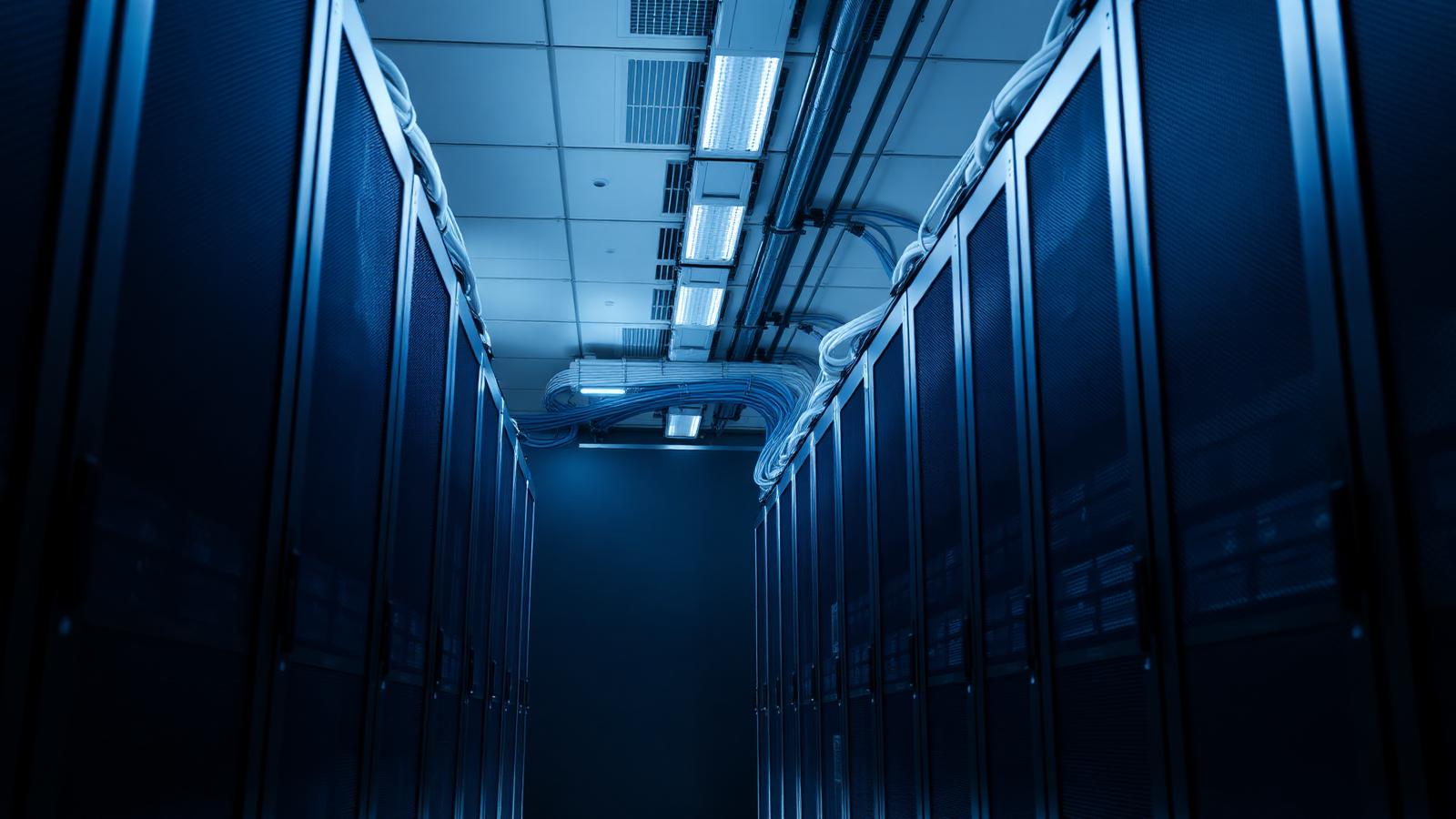 Data centre server aisle in cool light, representing private-markets accounting technology infrastructure